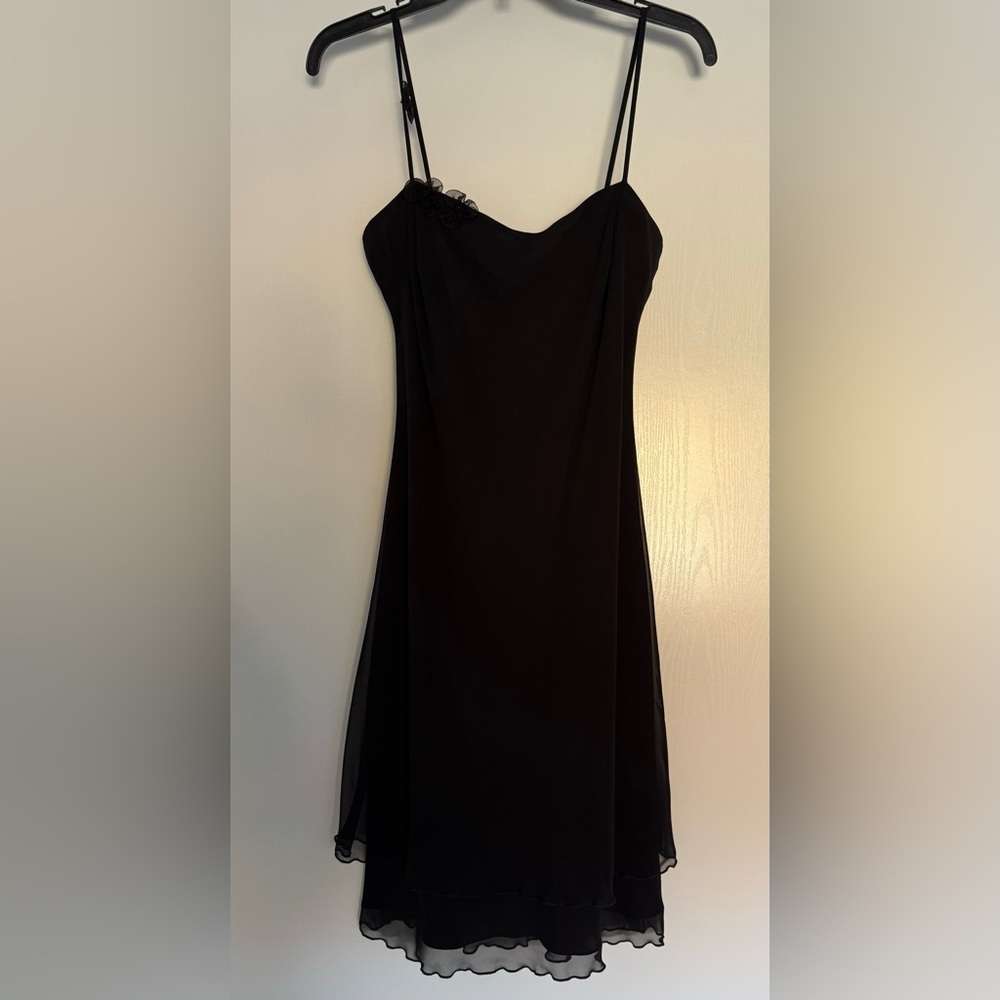 Black chiffon, two-tier spaghetti strap dress with flour embellishments.